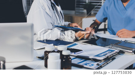 Young brunette woman having consultation at doctor office during 127753830