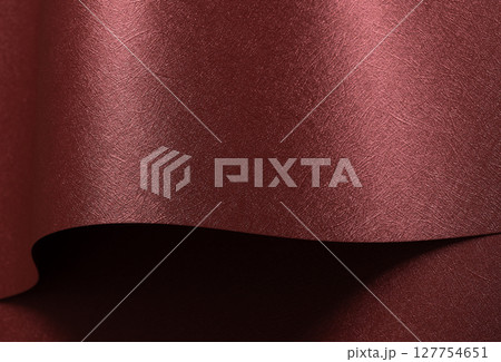 Chic paper background in red and marsala. Pearlescent metallic surface with glossy folds, wavy Chic paper background in red and marsala. Pearlescent metallic surface with glossy folds, wavy 127754651