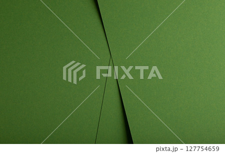 Designer paper background in green. Matte and smooth surface with fiber texture, geometric overlap 127754659