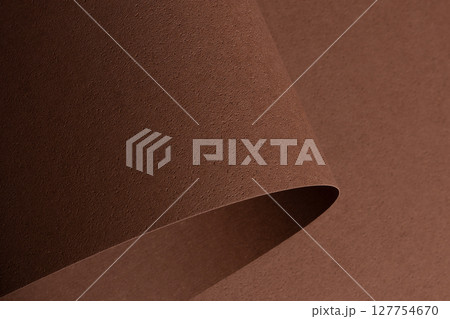 Elegant designer paper background in chocolate brown coffee tones with pitted porous texture and Elegant designer paper background in chocolate brown coffee tones with pitted porous texture and 127754670