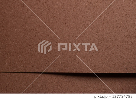 Premium designer paper in chocolate brown tones with pitted porous texture and spongy perforated Premium designer paper in chocolate brown tones with pitted porous texture and spongy perforated 127754785