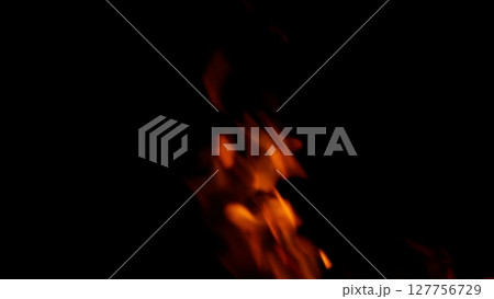 Dynamic Flames Dance in the Dark Enveloping the Night, Creating a Hypnotic Atmosphere Dynamic Flames Dance in the Dark Enveloping the Night, Creating a Hypnotic Atmosphere 127756729