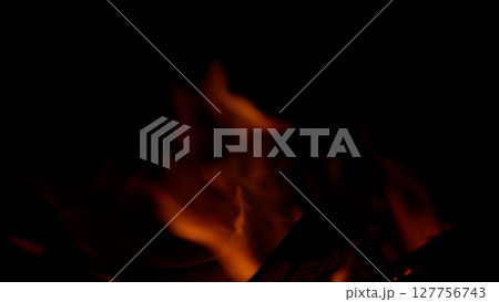 Captivating and Enigmatic Flames Emerging from the Depths of Darkness A Beautiful Dance of Fire 127756743