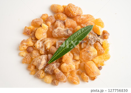 Frankincense or olibanum aromatic resin isolated on white background used in incense and perfumes. 127756830