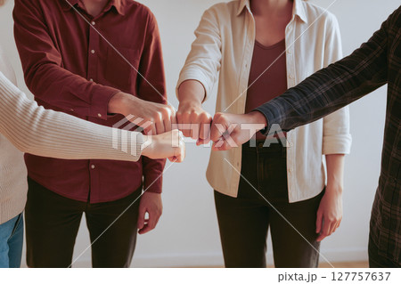 Four colleagues brainstorm with high communication and leadership skills in contemporary corporate development meeting showing adviser support and business teamwork in blank office space Four colleagues brainstorm with high communication and leadership skills in contemporary corporate development meeting showing adviser support and business teamwork in blank office space 127757637