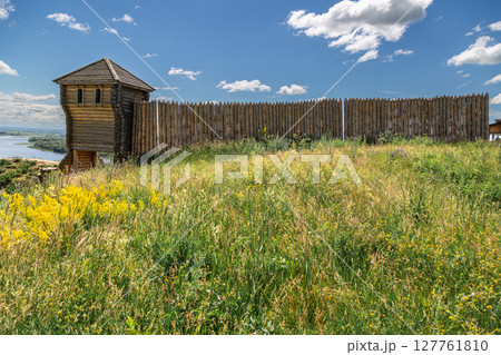 Ancient wooden fortress on a background of river spaces. Russia, Tatarstan, ancient Bulgar fortress in Yelabuga Ancient wooden fortress on a background of river spaces. Russia, Tatarstan, ancient Bulgar fortress in Yelabuga 127761810