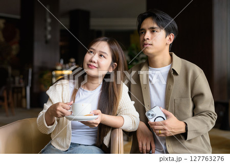 Young happy couple drinking coffee 127763276