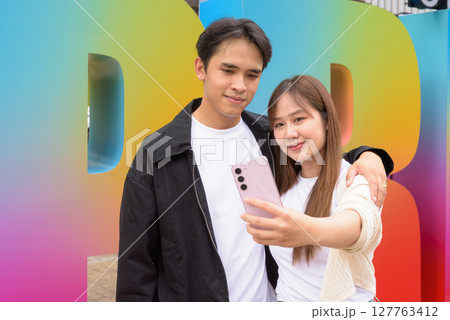 LGTBQ Pride supporting couple selfie portrait 127763412