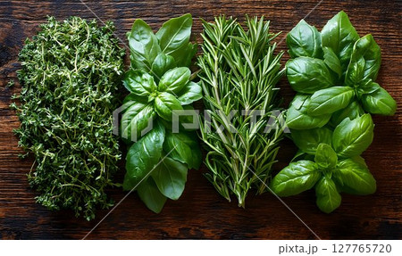 Fresh green herbs on rustic wood background culinary food photography 127765720