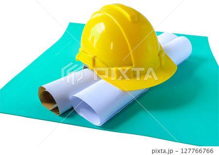 Drawings Architect rolls  and  safety helmet on the desk. 127766766