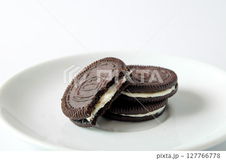 Chocolate cookie with cream on background. 127766778