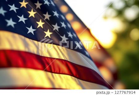 American flag waving in the wind against a warm sunset background. AI generated American flag waving in the wind against a warm sunset background. AI generated 127767914