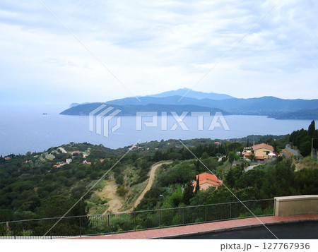 Panoramic distant view of the sea from the island of Elba, Italy, showcasing the vast expanse of the shimmering Mediterranean waters stretching toward the horizon. Panoramic distant view of the sea from the island of Elba, Italy, showcasing the vast expanse of the shimmering Mediterranean waters stretching toward the horizon. 127767936
