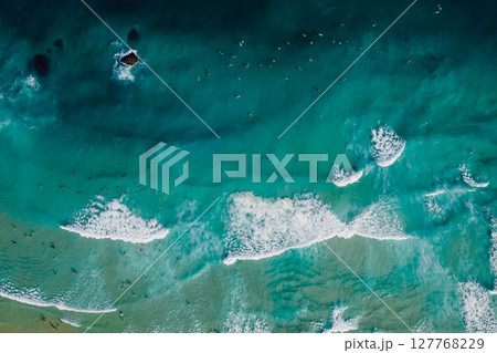 Top down view of blue ocean with crashing waves, drone shot Top down view of blue ocean with crashing waves, drone shot 127768229