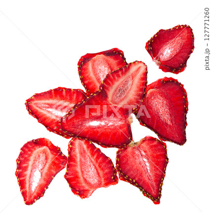 Dried strawberry slices isolated on white background. Dehydrated strawberries chips. Clipping path. Top view. 127771260