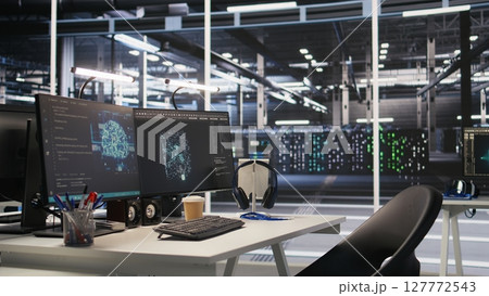 Server hub PC screens tracking rackmounts processing large scale machine learning datasets for artificial intelligence operations. Computer displays monitoring gear used in AI model development 127772543