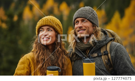 Smiling Couple Hiking in Autumn Forest 127774075