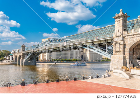 View of the Moscow river embankment, Pushkinsky bridge and cruise ships at sunset. 127774919