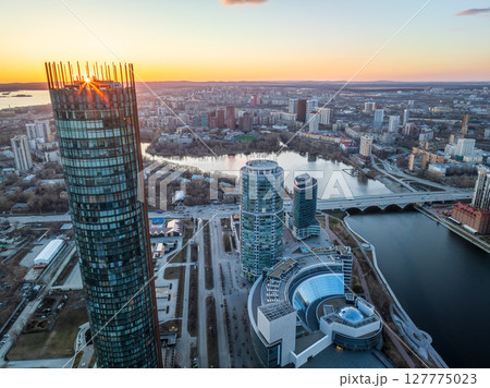 Yekaterinburg aerial panoramic view in spring at sunset. Yekaterinburg city and pond in spring or autumn. 127775023