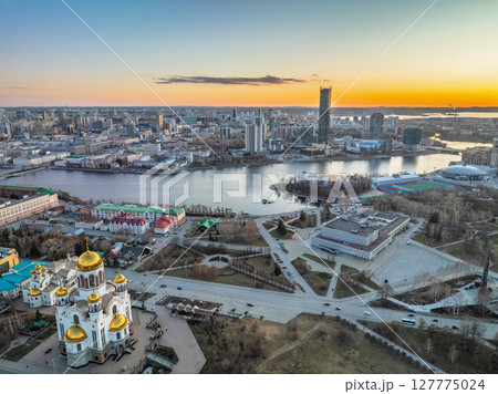 Early spring or autumn Yekaterinburg and Temple on Blood in clear sunset. Aerial view of Yekaterinburg, Russia. Translation of the text on the temple: Honest to the Lord is the death of His saints. 127775024