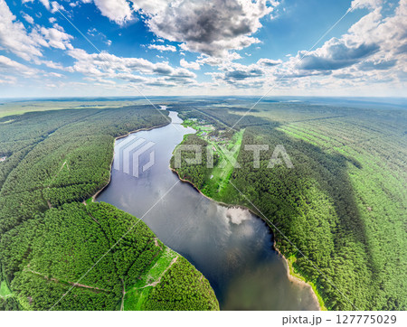 Big lake with green shores in bright sun light, aerial landscape. Recreation concept. Aerial view Big lake with green shores in bright sun light, aerial landscape. Recreation concept. Aerial view 127775029