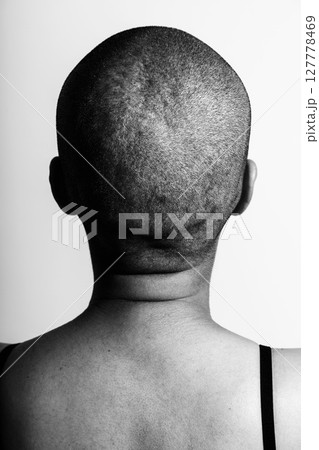 Woman with shaved head nape and back portrait Woman with shaved head nape and back portrait 127778469