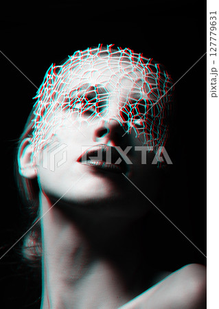 Beautiful woman with fancy make-up and abstract face mask studio portrait in RGB color split effect style 127779631