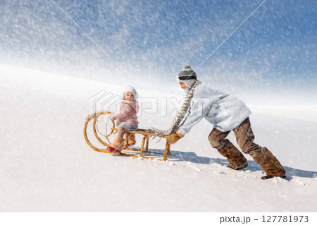 Children sled down the hill Children sled down the hill 127781973