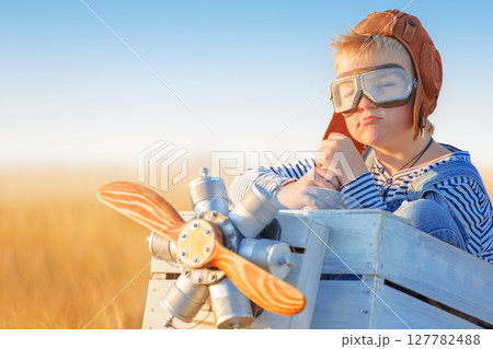 Little boy is playing the plane. Little boy is playing the plane. 127782488