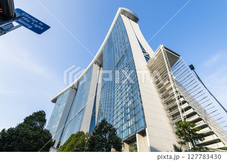 Building view of the Marina Bay Sands Hotel, Singapore, includes three towers topped by the Sands Skypark, a skyway, and an infinity-edge swimming pool. Building view of the Marina Bay Sands Hotel, Singapore, includes three towers topped by the Sands Skypark, a skyway, and an infinity-edge swimming pool. 127783430