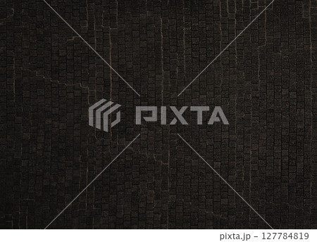 暗い消炭色の古びた石畳の路面の背景画像 127784819