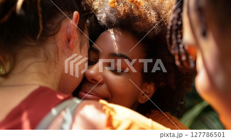 An LGBTQ+ person finds strength in supportive friends during a challenging time, fostering resilience. 127786501