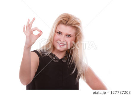 Blonde woman showing a ok gesture Blonde woman showing a ok gesture 127787208