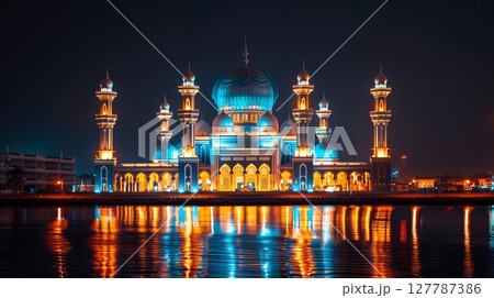 A mosque shines brightly for Eid Mubarak, symbolizing hope and togetherness in celebration. 127787386