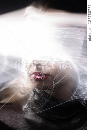 Abstract woman studio portrait with light painting technique Abstract woman studio portrait with light painting technique 127788773