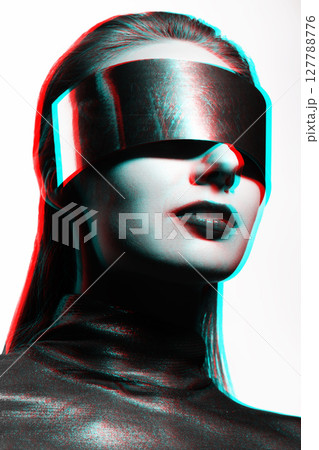 Abstract woman studio portrait with metallic glasses or helmet covering her eyes in RGB color split effect style Abstract woman studio portrait with metallic glasses or helmet covering her eyes in RGB color split effect style 127788776