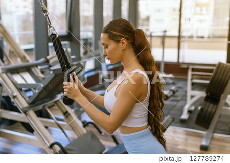 Sexy fitness woman doing exercises. Healthy lifestyle concept. Cross-fit bodybuilder in gym. Sexy fitness woman doing exercises. Healthy lifestyle concept. Cross-fit bodybuilder in gym. 127789274