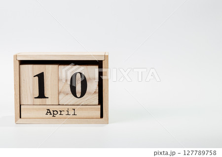 Wooden calendar April 10 on a white background Wooden calendar April 10 on a white background 127789758