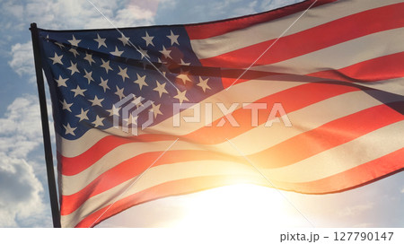 close up American flag waving in the wind against sunset. outdoor background for 4th of July, Memorial Day, Independence Day, Veterans Day, Celebrate USA, American President Election close up American flag waving in the wind against sunset. outdoor background for 4th of July, Memorial Day, Independence Day, Veterans Day, Celebrate USA, American President Election 127790147