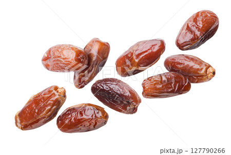 Dates fruits flying close-up on a white. Isolated Dates fruits flying close-up on a white. Isolated 127790266