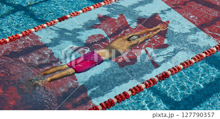 Top view of male swimmer diving into pool with Canadian flag. Global sports competition 127790357