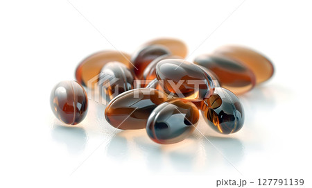 close-up of translucent softgel capsules on a white background 127791139