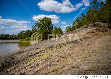 Lava rock formation known as the Love Stone on the bank of the Biya River in Altai, Russia. Concept of sacred natural landmarks and emotional symbolism in wild nature Lava rock formation known as the Love Stone on the bank of the Biya River in Altai, Russia. Concept of sacred natural landmarks and emotional symbolism in wild nature 127791271
