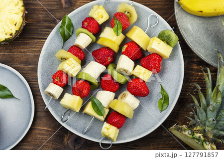 Colorful fruit skewers. Colorful fruit skewers. 127791857