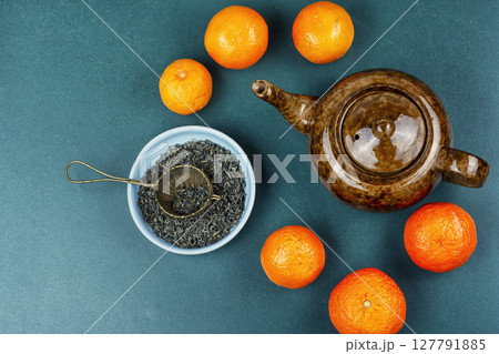 Mandarin tea in ceramic tea pot. Mandarin tea in ceramic tea pot. 127791885