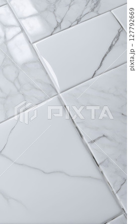 Glossy white marble tiles with natural veining and reflections. Elegant ceramic surface for interior design, flooring, and wall decoration Glossy white marble tiles with natural veining and reflections. Elegant ceramic surface for interior design, flooring, and wall decoration 127792669