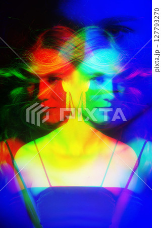 Beautiful woman with long blowing wavy hair studio portrait in RGB color split effect style Beautiful woman with long blowing wavy hair studio portrait in RGB color split effect style 127793270