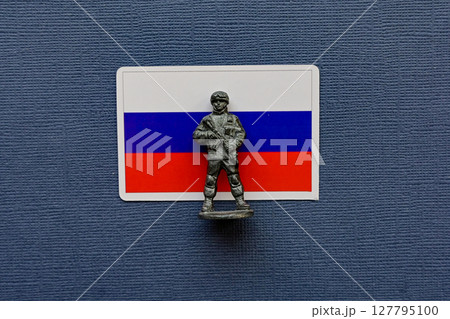 Flags of Russia on a blue background. The Russian-Ukrainian conflict. 127795100