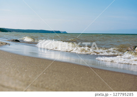 Baikal lake sand beach, Olkhon island. Summer natural landscape. Baikal lake sand beach, Olkhon island. Summer natural landscape. 127795285