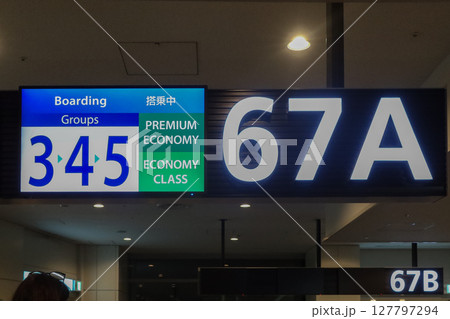 Boarding sign for premium economy and economy class at Haneda Airport Terminal 2 in Tokyo, Japan. May 7, 2025 127797294
